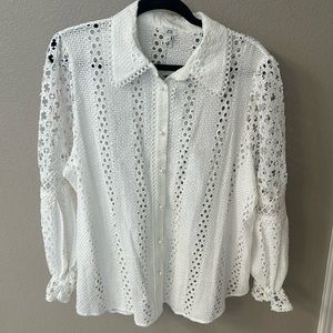 Crochet top with pearl buttons.